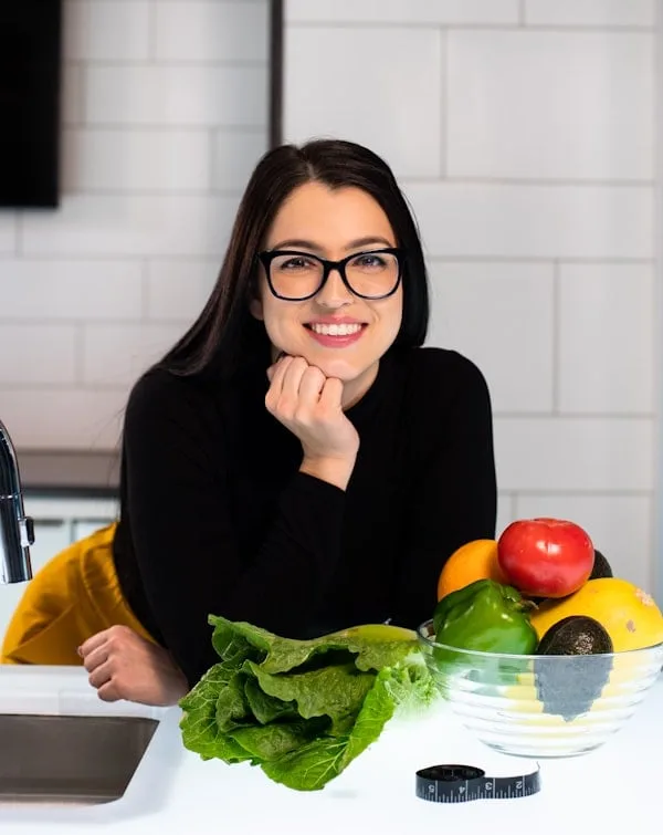 A dietitian preparing fresh vegetables for a counseling session