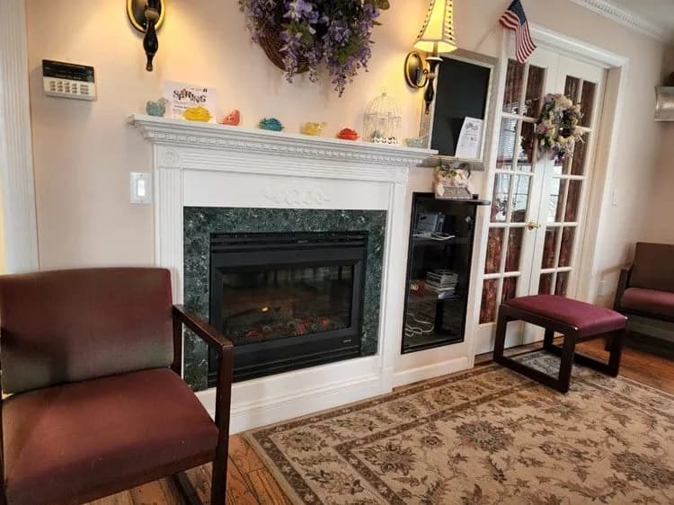 The Nutrition Balance office waiting room with its fireplace